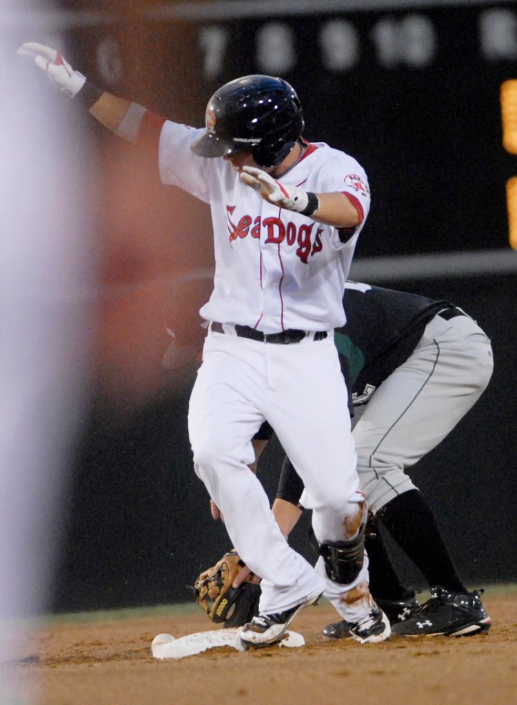 Ryan Khoury of the Portland Sea Dogs beats the tag to reach second base with a double Wednesday night against the Altoona Curve at Hadlock Field. The Sea Dogs have lost the first two games of the three-game series against Altoona.