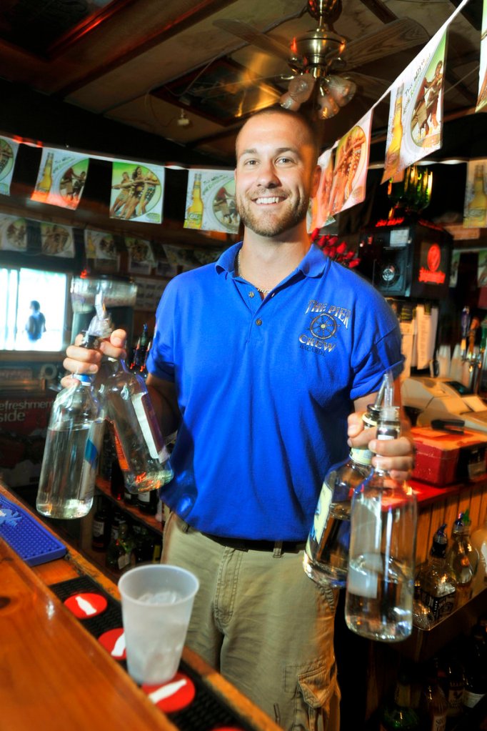 Bartender Travis Beaulieu prepares to mix up a Long Island iced tea.