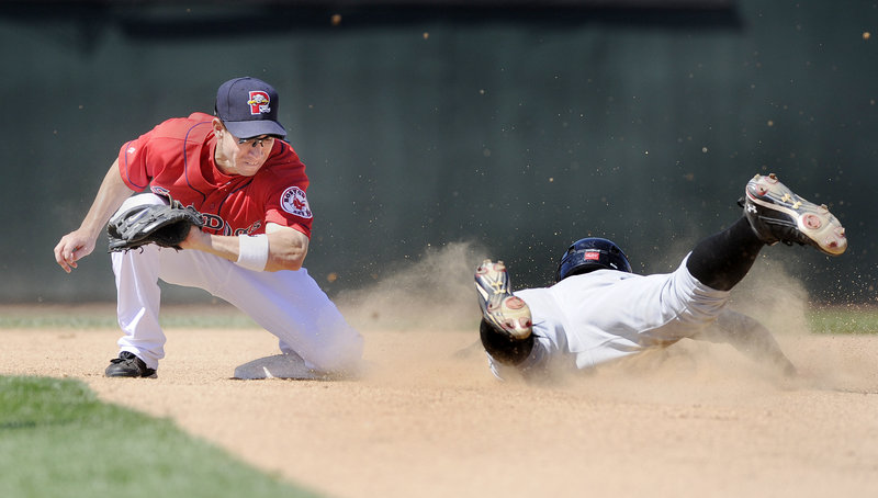 Sea Dogs second baseman Nate Spears prepares to swipe the tag on Chase d'Arnaud of the Altoona Curve and snuff out a steal attempt Thursday at Hadlock Field. Portland ended a three-game losing streak with a 9-8 victory.