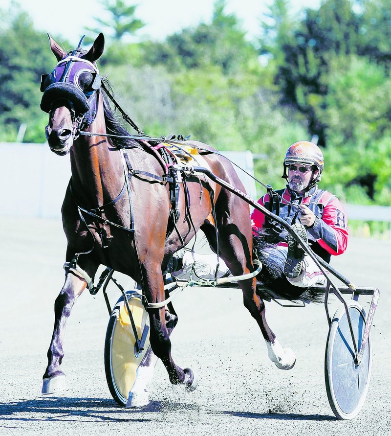 Harris and Fast Guy navigate the track Thursday. Officials in Biddeford this week took a preliminary step that might entice Scarborough Downs to move.