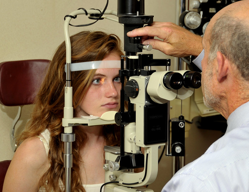 Dr. Steven Goldstein examines Addison Wood’s eyes. Research into increasing nearsightedness among teens is scarce, but “I think it’s happening right in front of us, it’s so new,” Goldstein says.