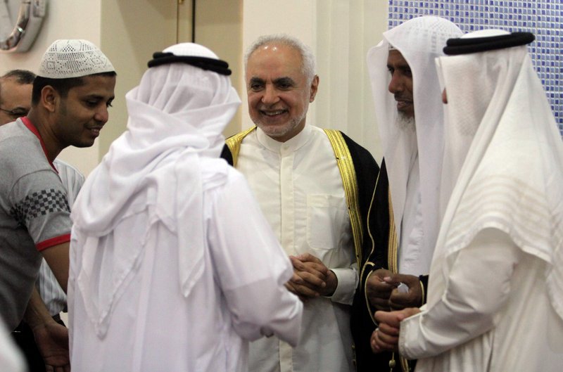 Imam Feisal Abdul Rauf, right, greets worshippers inside a mosque in Muharraq, Bahrain, after leading prayers Friday. Rauf, the imam leading plans for an Islamic center near ground zero in New York, is in the Mideast on a State Department outreach mission.