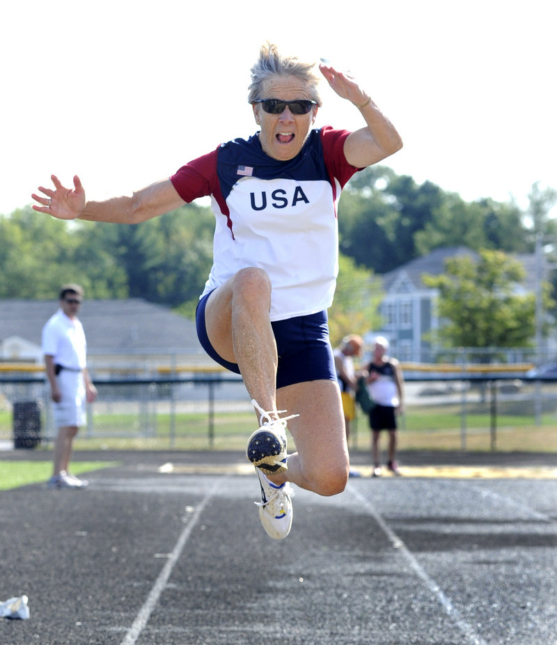 Barbara Jordan, 74, of South Burlington, Vt., competes in the long jump, finishing second in her age group with a jump of 8 feet, 9 1/2 inches at Scarborough High.