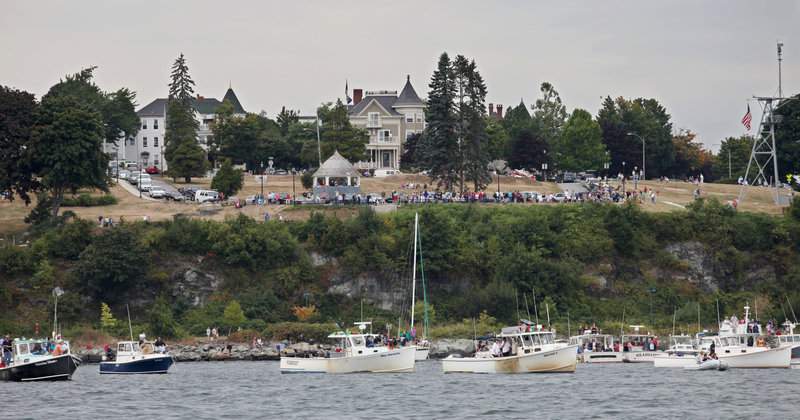 Spectators along the East End watch the Portland Lobster Boat Races on Sunday. More than 50 lobster boats participated in the first lobster boat race in Portland Harbor in 24 years.