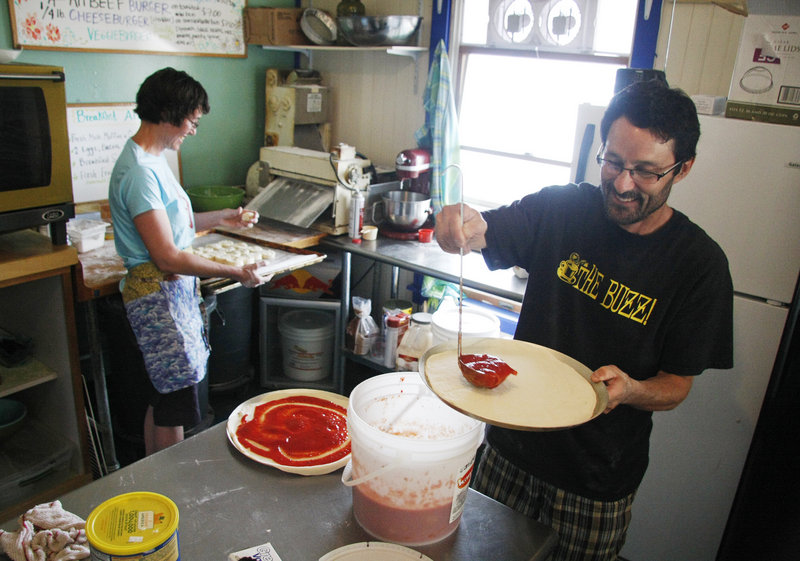 Steve and Johanna Corman prepare pizza and shortcakes for lunch and dessert at Pearls Seaside Market on Cliff Island. Steve Corman teaches at Bonny Eagle High School.