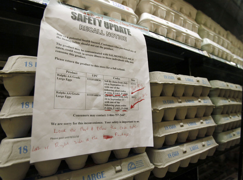 A sign at a Los Angeles supermarket warns customers of the recall of certain lots of eggs. One of the farms tied to the recall, DeCoster Egg Farms, paid a $2 million fine in Maine in 1997.