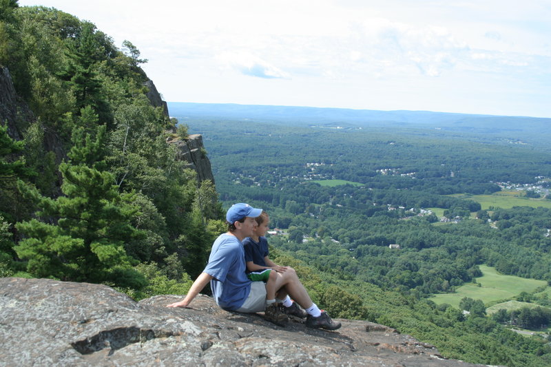 The view from the top of a New England hike is a beautiful thing, and Maine author Jeff Romano, pictured with his son, has compiled a list of the best trails in his new book, “100 Classic Hikes of New England.”