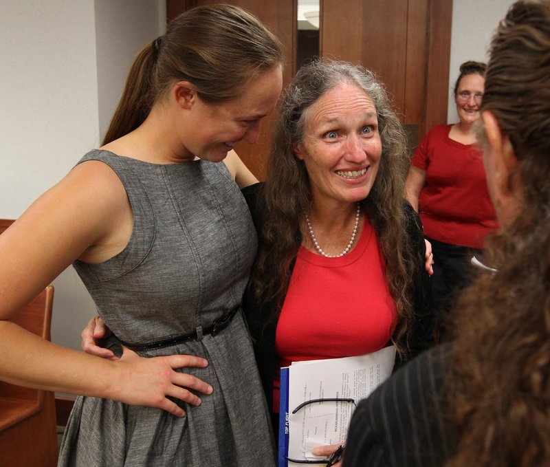 Shirley Phelps-Roper, right, hugs her niece Jael Phelps after an agreement was reached with Nebraska officials Monday in Papillion, Neb. Phelps-Roper agreed to drop federal lawsuits against Nebraska authorities in exchange for a prosecutor dismissing charges against her connected to a 2007 protest.