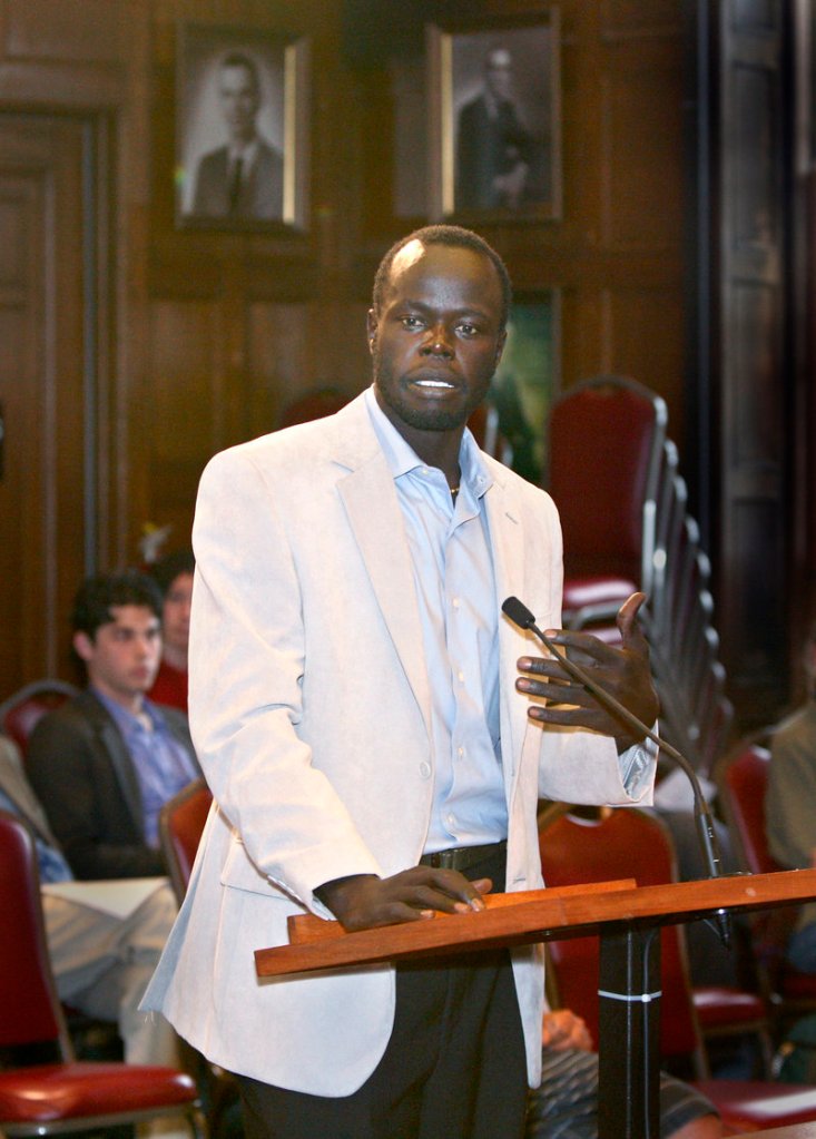 Alfred Jacob, a Sudanese immigrant and one of the leaders of the petition drive, speaks in favor of allowing non-citizens the right to vote during a public hearing Monday.