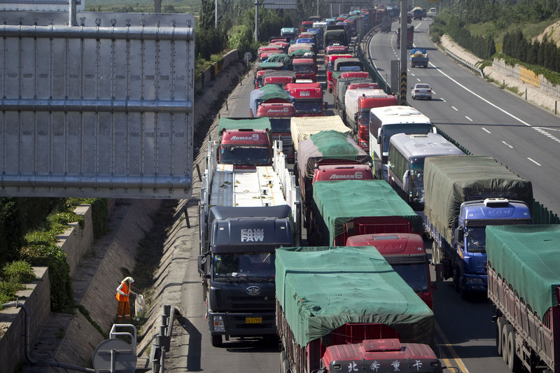 A section of the Beijing-Tibet highway in Huailai, in north China’s Hebei province remains clogged with traffic on Tuesday. The massive traffic jam stems from road construction on one of three southbound highways feeding into Beijing that won’t be finished until the middle of next month.