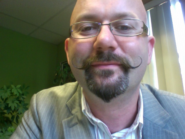 AFTER: Dr. Lou Jacobs with the handlebar moustache.