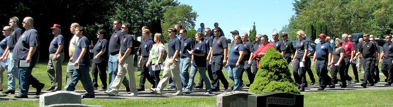 Fire and rescue workers from eight towns in Somerset County walked past the grave of Donna Lightbody, 63, on Tuesday to pay their respects. Lightbody was president of the Madison Fire Department Auxiliary and the wife of the town's fire chief.
