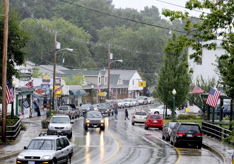 Traffic moves along Route 302 in Bridgton on Wednesday. The town is the latest example of a Maine community worrying about big chains in its midst.