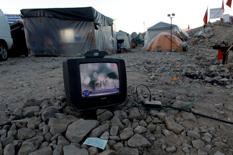 An image of Florencio Avalos, one of the 33 miners trapped in the San Jose collapsed mine, is seen on a TV set near the mine in Copiapo, Chile, on Thursday. The miners, who have been trapped since the shaft they were working in collapsed on Aug. 5, were reached Sunday via a small hole.