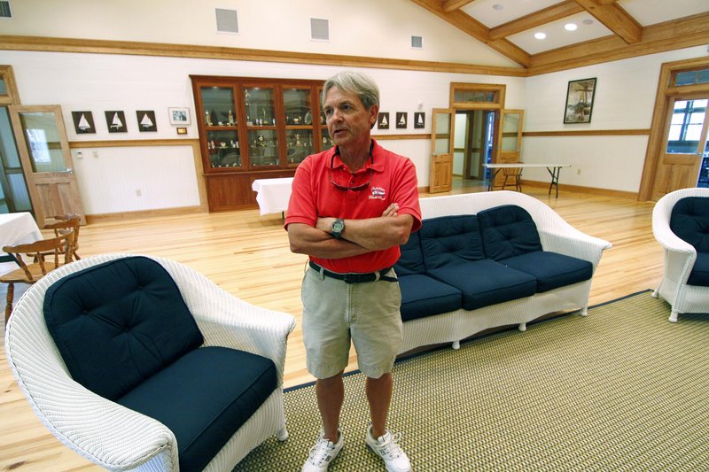 Erik Schmitz, former commodore of the Fairhope Yacht Club, says members helped navigate the system to obtain a loan of about $1.5 million to rebuild and expand the club’s meeting hall in Fairhope, Ala. Other funds also were used.