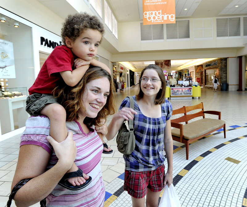 Maine Mall shoppers Candace Davis of Westbrook, her son Dominic Diego Davis, 3, and daughter Caitlin Morgan, 12, shop for school items Friday at the Maine Mall in South Portland.
