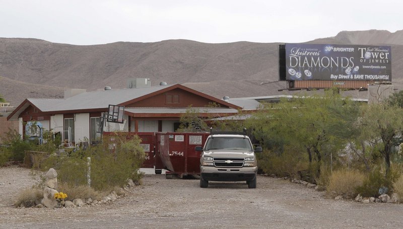 A pick-up truck and Dumpster are seen outside the home of Billie Jean James and her husband, Bill, on Thursday in Las Vegas.