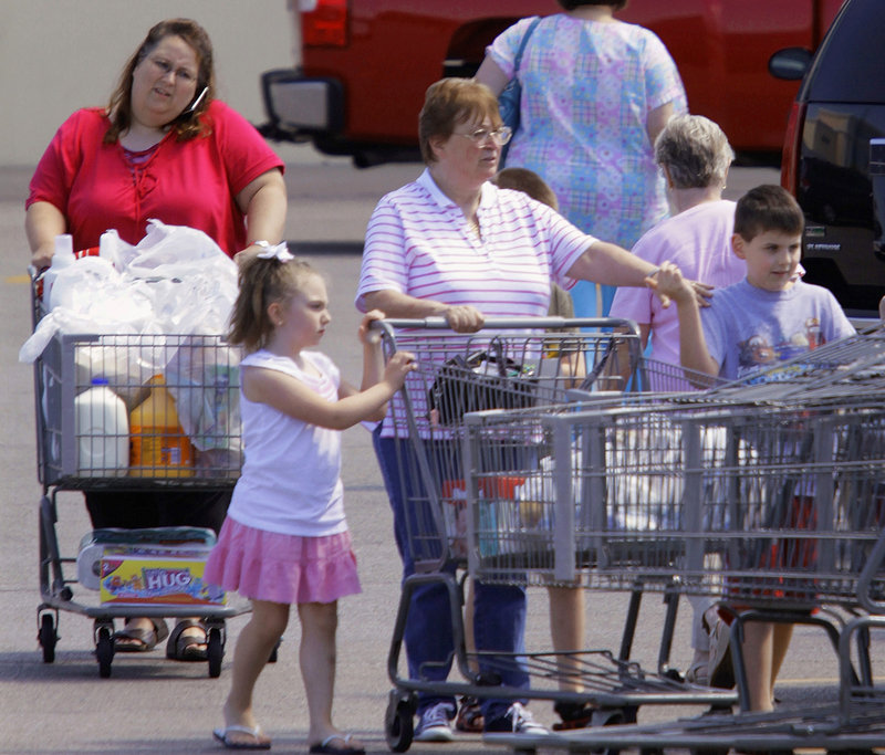 Shoppers leave a Walmart super center in Springfield, Ill., last week. Consumer spending rose 0.4 percent in July, the best showing since March following three months when spending was essentially flat. But without job growth, consumers are not expected to spend much more.