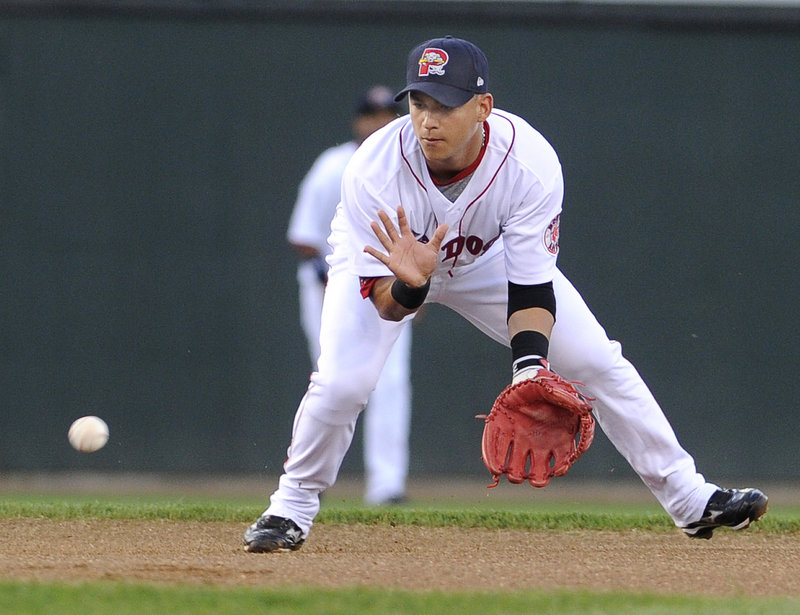 Jose Iglesias fields a ground ball for an out Monday night against the Binghamton Mets. Portland opened its season-ending, eight-game homestand with a 7-6 win.