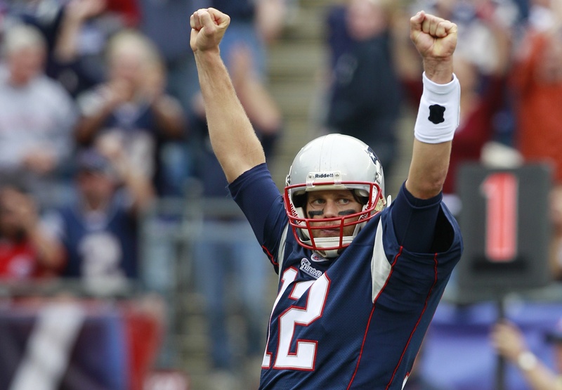 Patriots quarterback Tom Brady celebrates a touchdown by running back BenJarvus Green-Ellis during the fourth quarter against the Buffalo Bills in Foxborough, Mass., on Sunday. The Pats won, 38-30