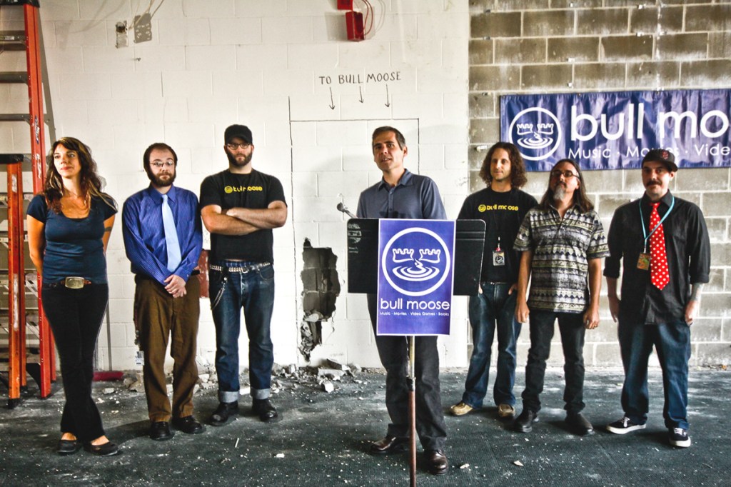 Bull Moose Music owner Brett Wickard, center, announced the expansion of the Scarborough warehouse with location staff, pictured from left, Amber Dorcus, Chris Gilman, Matt Cargile, BJ Carr, Chris Brown and Jay Kelley.