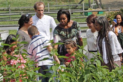 First lady Michelle Obama, Colombian first lady Maria Clemencia Rodriguez De Santos, second from right, and Haitian first lady Elisabeth D. Preval, take a tour of an herb garden at the Stone Barns Center with Executive Chef Dan Barber and local schoolchildren.