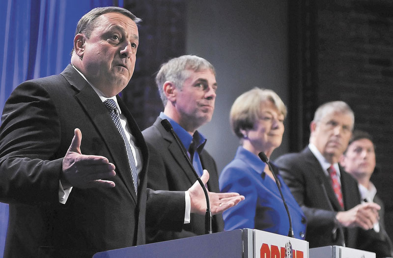 Republican Paul LePage, left, speaks as fellow gubernatorial candidates, from left to right, independent Shawn Moody, Democrat Libby Mitchell, independent Eliot Cutler and independent Kevin Scott listen during Saturday night’s debate at the University of Maine at Augusta.