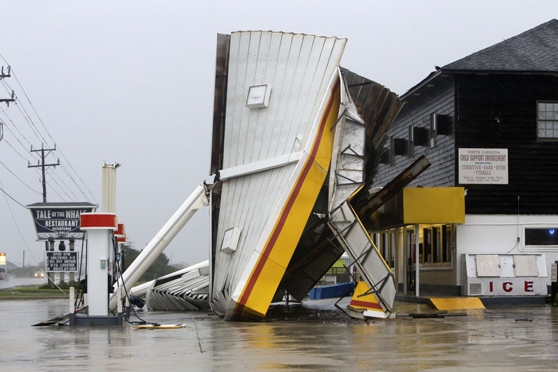 A metal roof is seen on the ground after winds from Hurricane Earl passed through Nags Head, N.C..