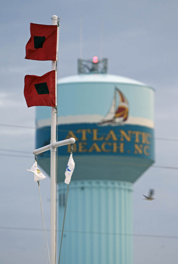 Hurricane flags blow in the wind in Atlantic Beach, N.C., today, as Hurricane Earl approaches.