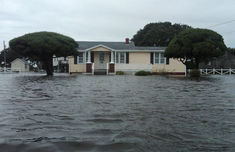Flood waters surround a home after Hurricane Earl swept through Avon, N.C., today.
