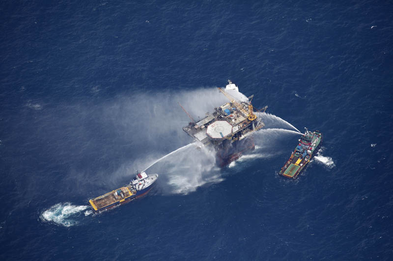 Fireboats spray water on an oil and gas platform that exploded in the Gulf of Mexico today.