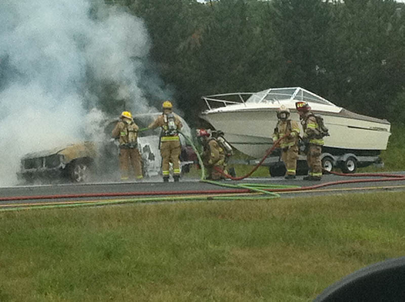 Firefighters extinguish car fire on northbound I-295 in Freeport.