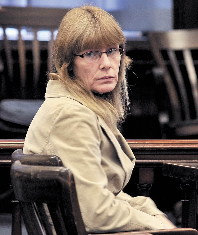 Karen McCaul looks back at family members of now deceased Richard Howe in Somerset Superior Court on Tuesday where she was found not criminally responsible by reason of insanity in the Christmas Eve 2009 stabbing death of Howe. McCaul was committed indefinitely to Riverview Psychiatric Center in Augusta.
