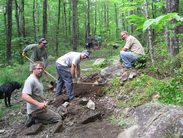 Volunteers with the Carrabassett Region chapter of the New England Mountain Biking Association work on a trail on Aug. 21. Mountain biking clubs in Maine have been busy building and opening trails.