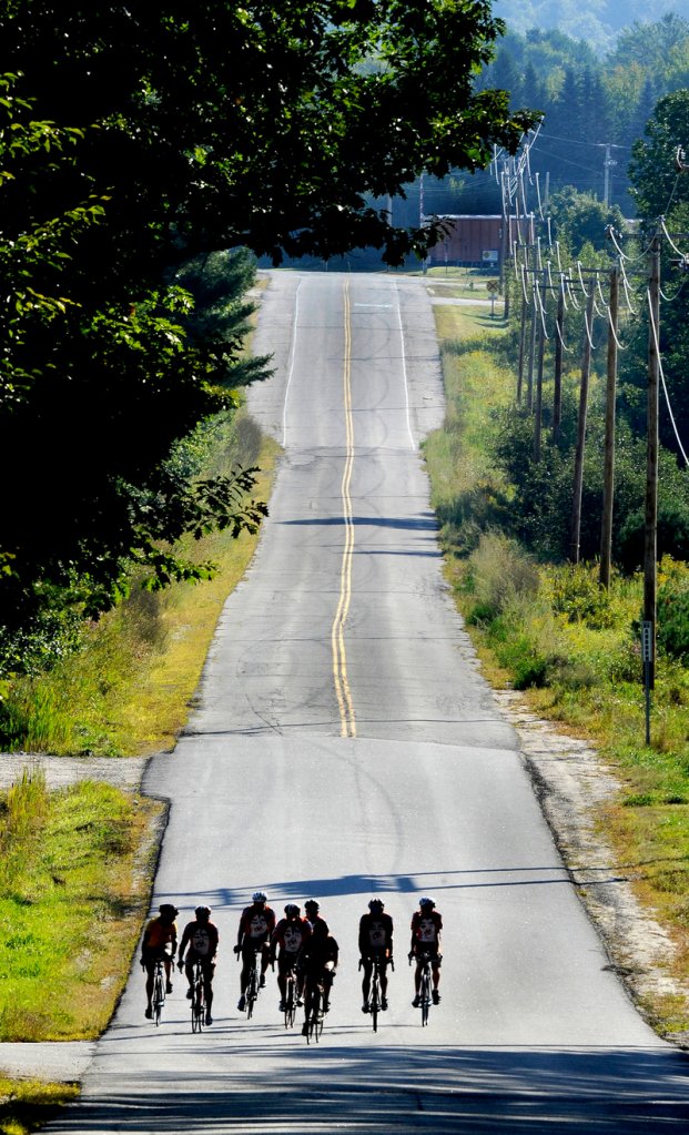 Maine Cycling Club members ride on a country road in the Auburn area that’s part of the Dempsey Challenge route.