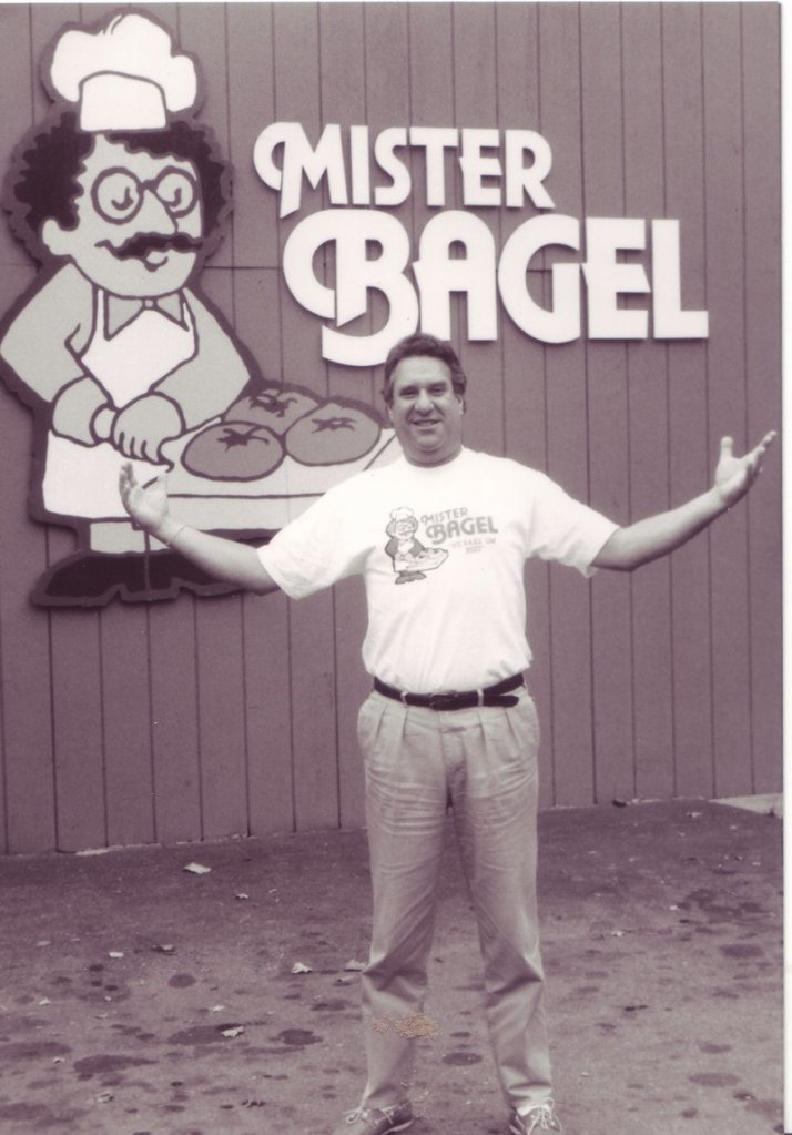 Eric “Rick” Hartglass created Mister Bagel’s trademark sign, a caricature of himself that now graces the signs of 12 franchises in Maine.