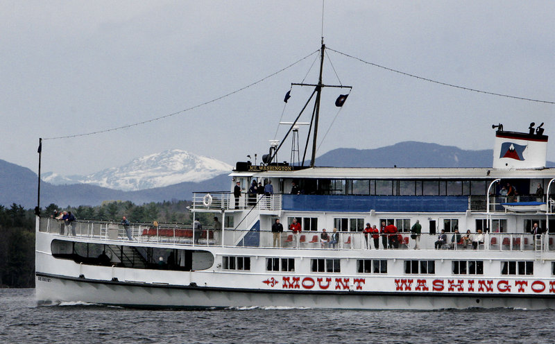 The excursion vessel SS Mount Washington cruises across Lake Winnipesaukee near Laconia, N.H., with a snow-covered Mount Washington itself in the background in this May 1, 2006, file photo. Readers discuss the question of whether Maine or the Granite State offers the best economic climate.