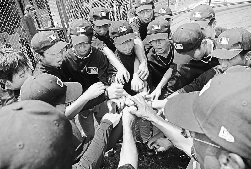 Players gather at a training camp in Wuxi, China. Major League Baseball is targeting teens in hopes of grooming potential talent and ultimately increasing the sport’s popularity in the most populous country.