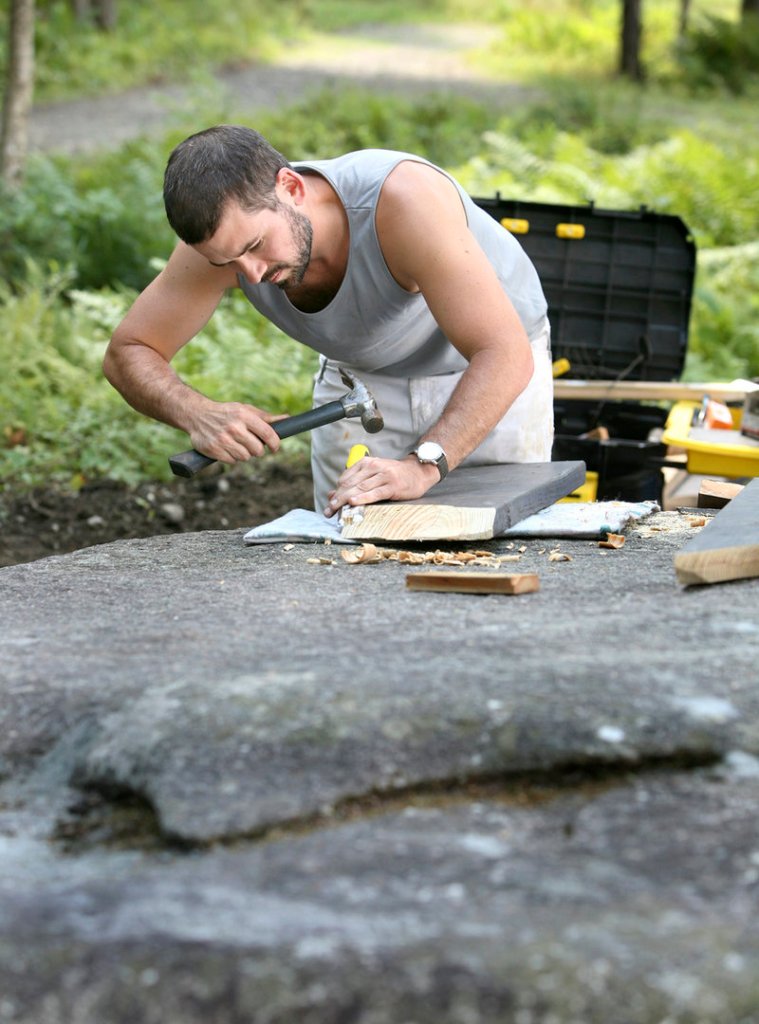 Wade Kavanaugh works on one of his picnic-table creations at Peaks-Kenny State Park.