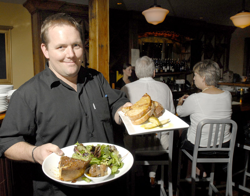 Old Vines Wine Bar owner Mike Farrell with a quiche special and a meatloaf panini.