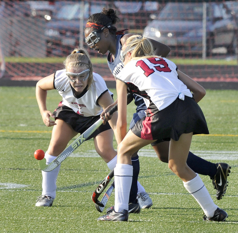 Ellen Taffere, who assisted Raechel Allen for Portland’s goal, looks for room against two Scarborough defenders, including Karli-An Gilbert, foreground.