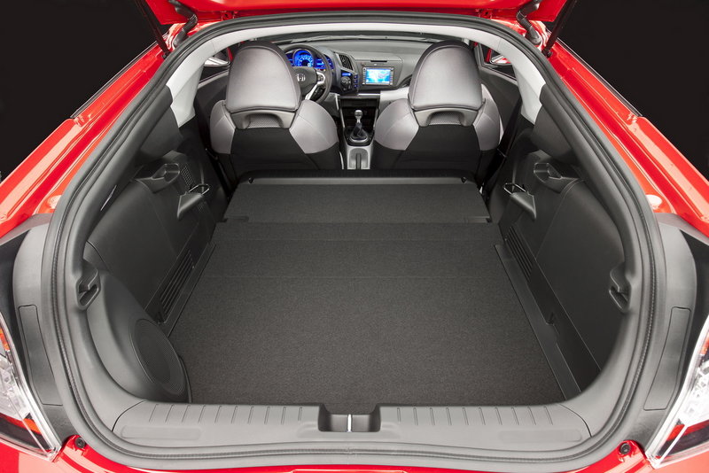 Cargo space is less roomy than the Honda CR-Z's thick rear quarters and hatchback design suggest, but it has a couple of useful cubbies behind the front seats.