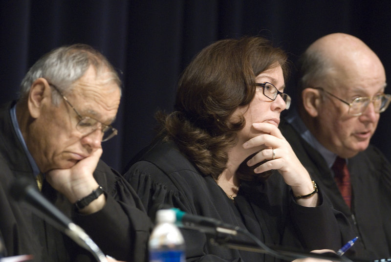 Maine Supreme Court justices hear arguments during a public session for students at Falmouth High School in 2007. From left are Justice Robert Clifford, Chief Justice Leigh Saufley, and Justice Donald Alexander.