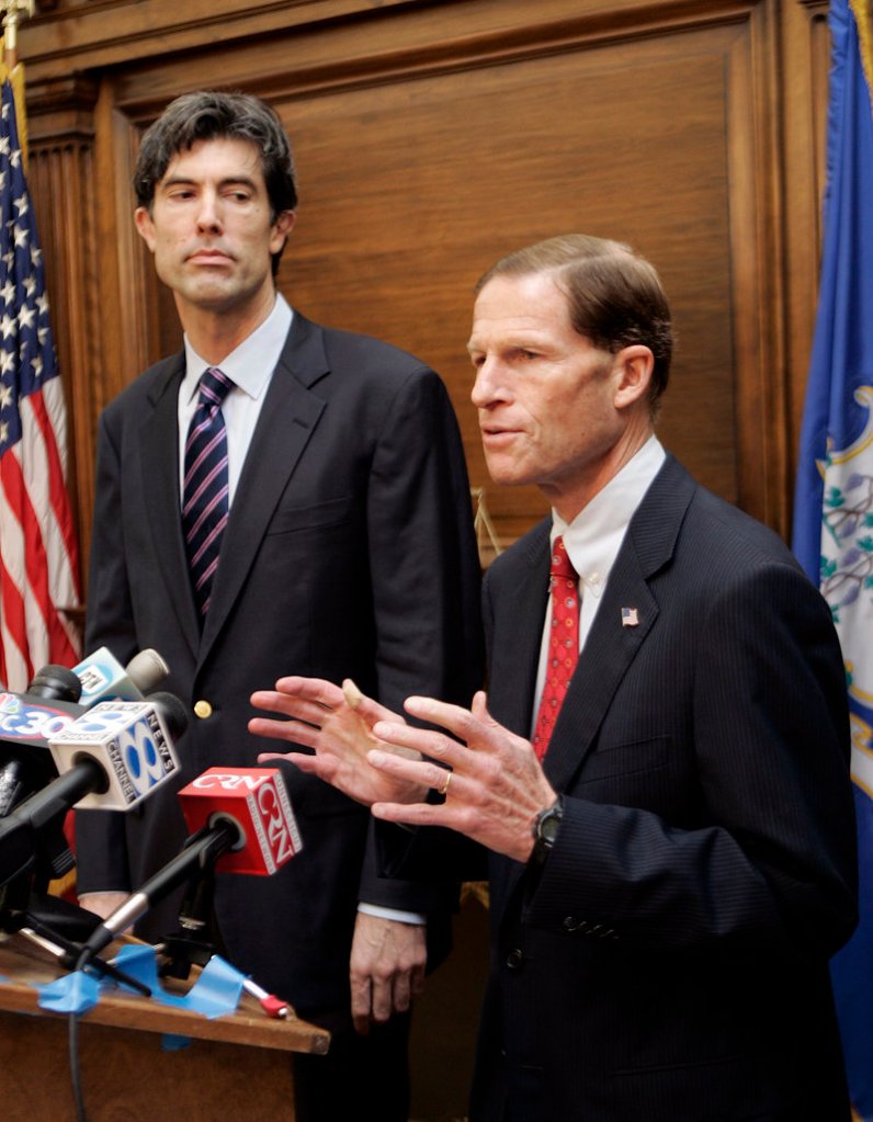 Jim Buckmaster, CEO of Craigslist, left, watches as Connecticut Attorney General Richard Blumenthal speaks at a news conference in Hartford in 2008. Blumenthal said Saturday he welcomed Craigslist’s move to shut down its adult services section. It’s unclear if the closure is permanent.