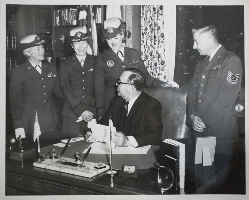 In a 1965 photo, Mary "Dottie" McGuirk, third from left, is pictured with California Gov. Pat Brown as he signs the Air Force Nurses Day proclamation.