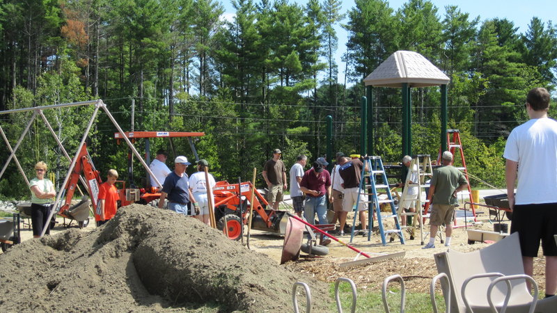 A large crew showed up despite 90-degree temperatures to install the Kelli Hutchison Memorial Playground at St. Ann's Episcopal Church in Windham.