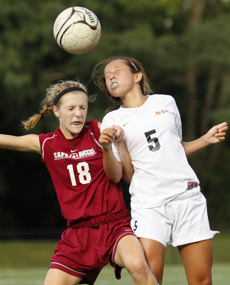 Hannah Twombly of North Yarmouth Academy, right, wins the ball against Madelaine Riker of Cape Elizabeth during their schoolgirl soccer game Tuesday. Cape Elizabeth improved to 2-0 with a 5-0 victory.