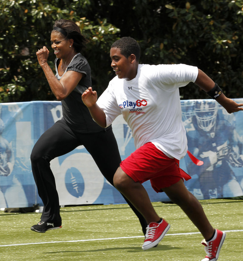 First lady Michelle Obama runs a 40-yard sprint Wednesday in New Orleans, as she participates in the Let’s Move! Campaign and the NFL’s Play 60 clinic with area youth – programs designed to promote exercise and fight childhood obesity. The first lady also appeared at an elementary school to promote a new phase of her anti-obesity program, which will focus on nutrition.