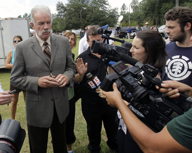 Pastor Terry Jones of the Dove World Outreach Center answers questions after a news conference in Gainesville, Fla., Wednesday. Jones said he is going forward with a plan to burn copies of the Quran.