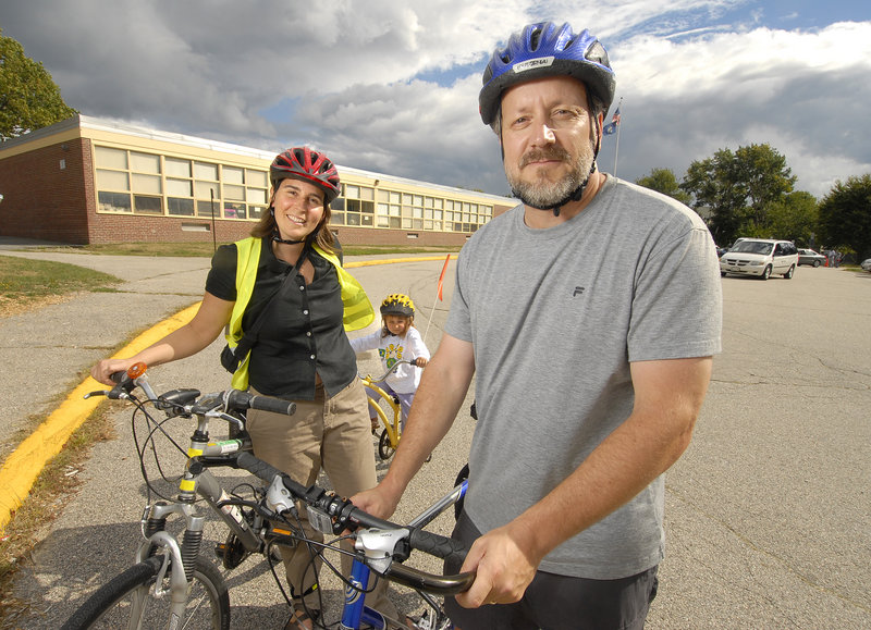 Bruce Hyman, Portland’s bicycle-pedestrian coordinator, is shown with Sarah Cushman of the Safe Routes to School program and her daughter, Cedar Levin, 3.